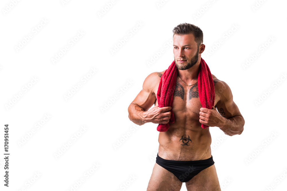 Handsome shirtless muscular man in briefs, standing, isolated on white background Handsome shirtless muscular man in briefs, standing, isolated on white background