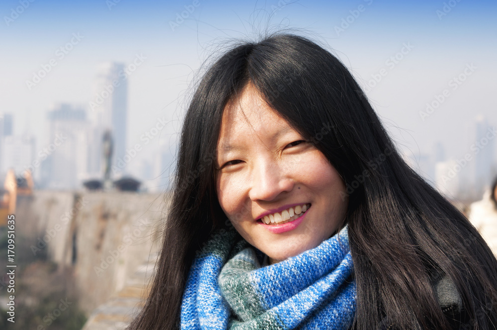 Smiling Chinese woman in the city of Nanjing China. Smiling Chinese woman in the city of Nanjing China.