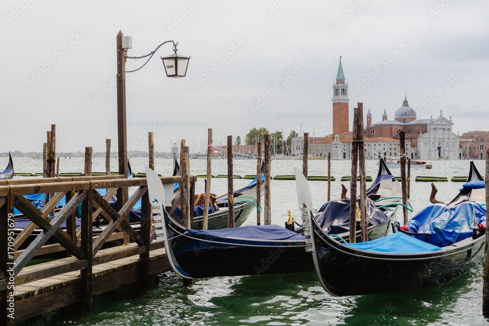 Traditional gondolas and San Giorgio Maggiore, Venice Italy