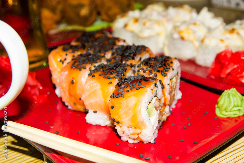 Traditional Japanese food. Fresh sushi at a Japanese restaurant. Japanese food on a wooden table. Traditional Japanese food. Fresh sushi at a Japanese restaurant. Japanese food on a wooden table.