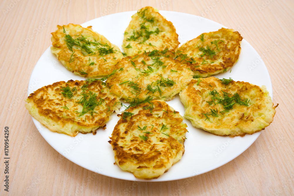 Pancakes with squash on a white plate Pancakes with squash on a white plate