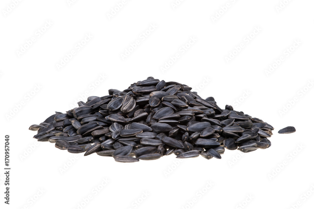 top view of pile of black roasted sunflower seeds isolated on white background with clipping path. top view of pile of black roasted sunflower seeds isolated on white background with clipping path.