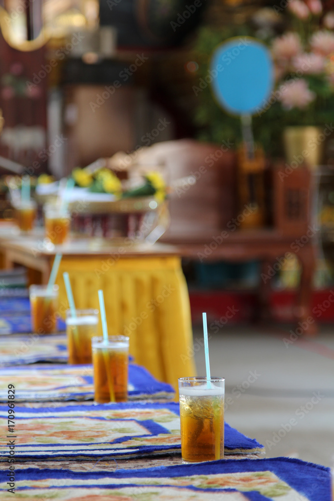 Iced tea in clear glass on table. Iced tea in clear glass on table.