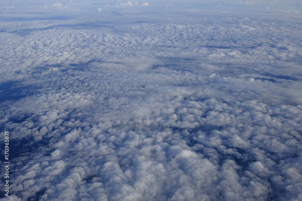 Flying above the clouds. view from the airplane, soft focus Flying above the clouds. view from the airplane, soft focus