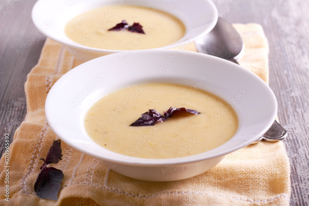 Cauliflower and courgette spicy soup in plate Cauliflower and courgette spicy soup in plate