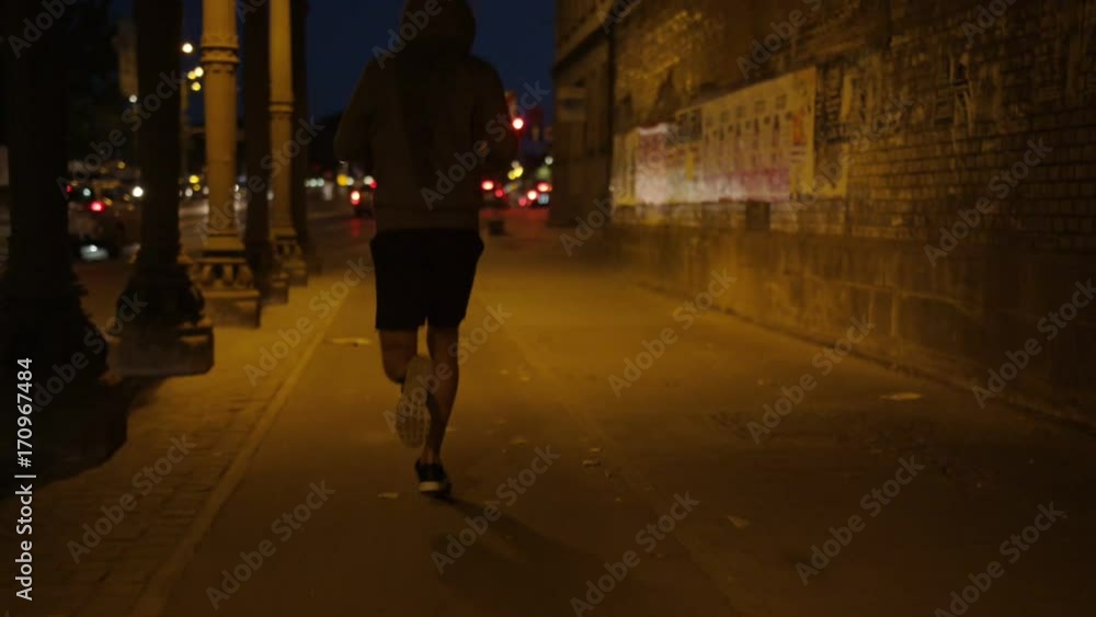 Handsome young athlete during jogging Handsome young athlete during jogging
