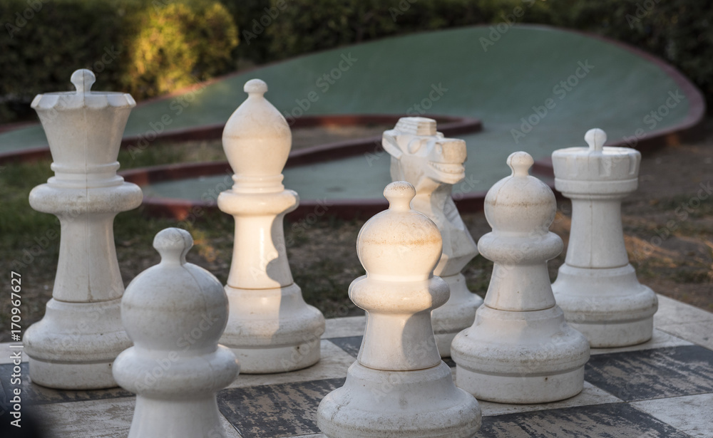 giant chess figures on chessboard in the park giant chess figures on chessboard in the park