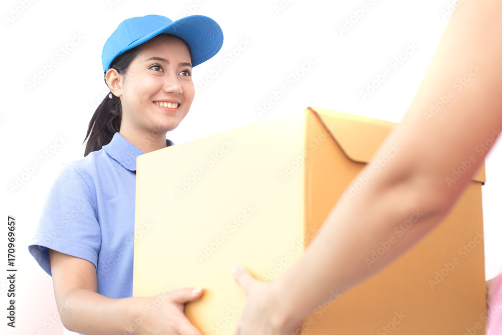 Young Asian Woman with Delivery service in uniform. Woman send Box to Customer with attractive smiling isolated on white background. Young Asian Woman with Delivery service in uniform. Woman send Box to Customer with attractive smiling isolated on white background.