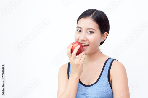 Asian Woman eating Apple, Woman eating Apple with attractivesmiling, isolated on white background.