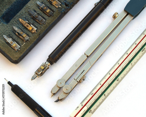 vintage technical drawing tools: mechanical pencil, scalemeter, compas and   technical drawing pencil photo