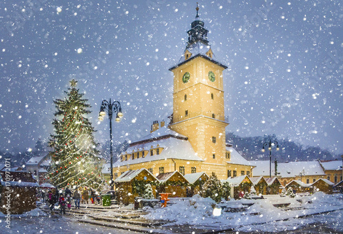 Christmas market and decorations tree in the main center of Brasov town  in winter season  Romania