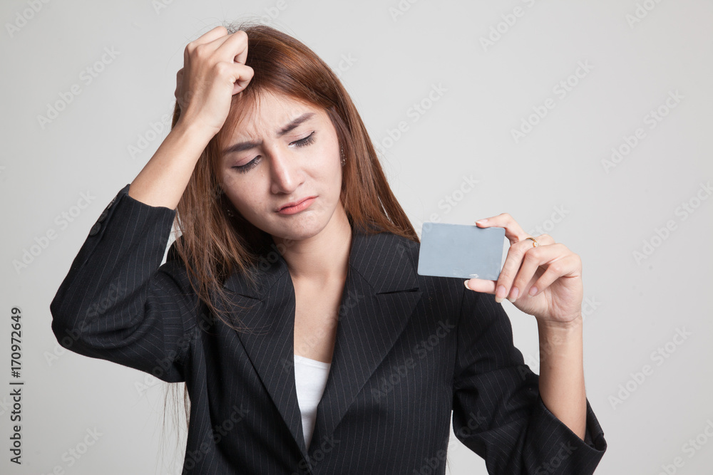 Young Asian woman headache with a blank card.
