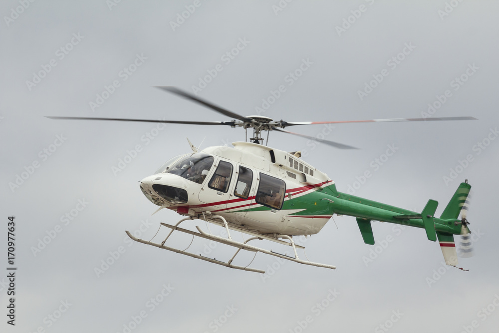 Small passenger helicopter in flight, close up