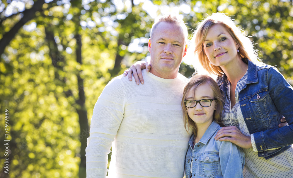 casual young family in the park casual young family in the park