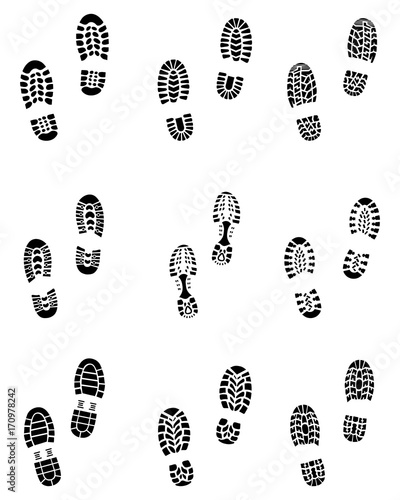 Various black prints of shoes on a white background