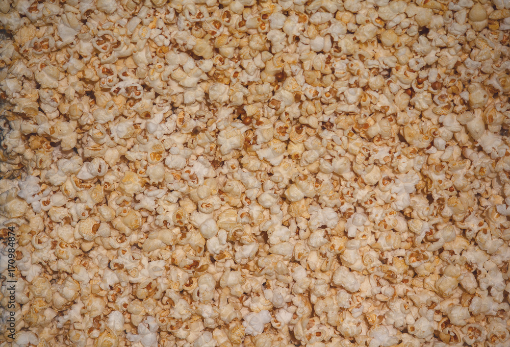 Golden popcorn grains close. Background and textures Golden popcorn grains close. Background and textures