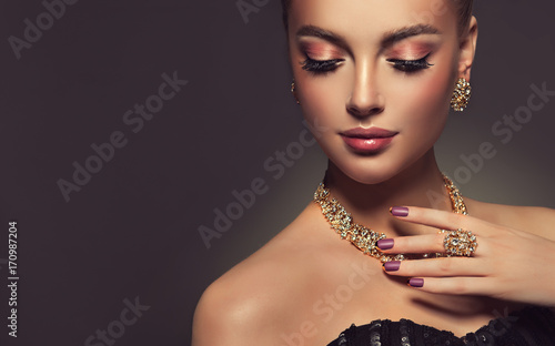 Beautiful girl with jewelry . A set of jewelry for woman ,necklace ,earrings and bracelet. Beauty and accessories.
