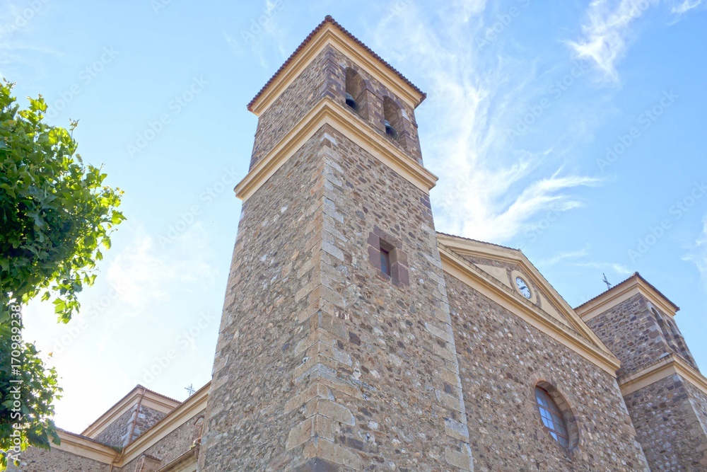 stoned church of Potes in a cloudless day, San Vicente in Spain