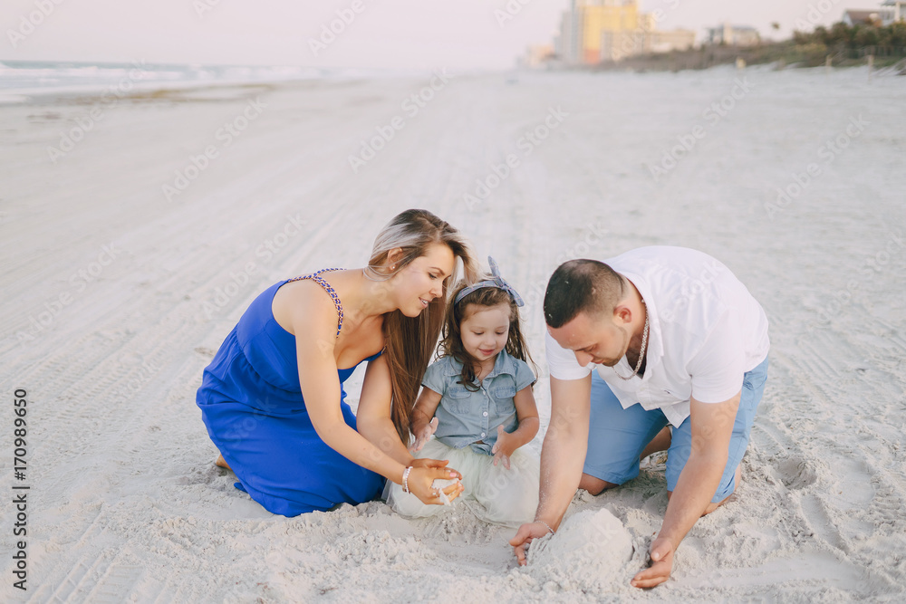 Fototapeta premium beautiful family on the beach