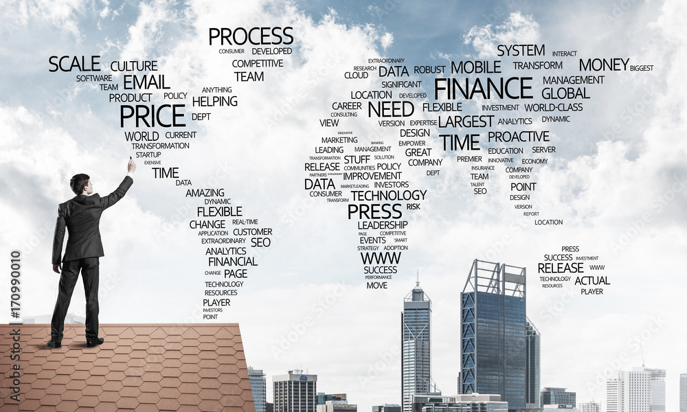 Businessman on brick roof draw world map as concept of globaliza Businessman on brick roof draw world map as concept of globaliza