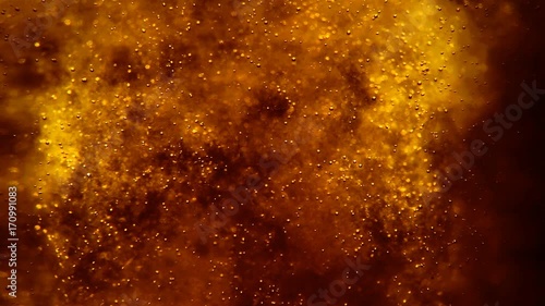 Bubbles floating in the amazing deep structured orange liquid. Blurred background with dimension. 