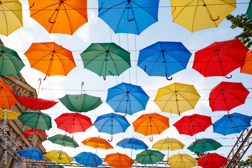 multicolor umbrellas in the sky