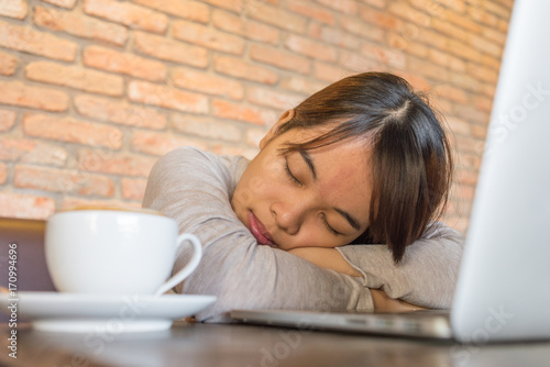 Young girl is too tired and sleep photo