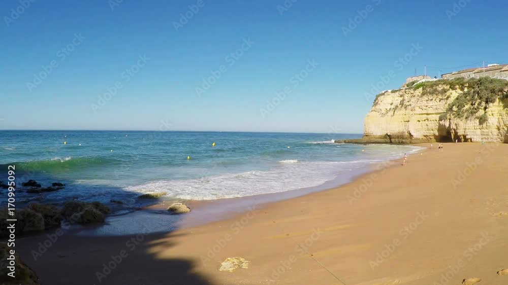 Beautiful summer weather on beach of the village Carvoeiro, Algarve Beautiful summer weather on beach of the village Carvoeiro, Algarve