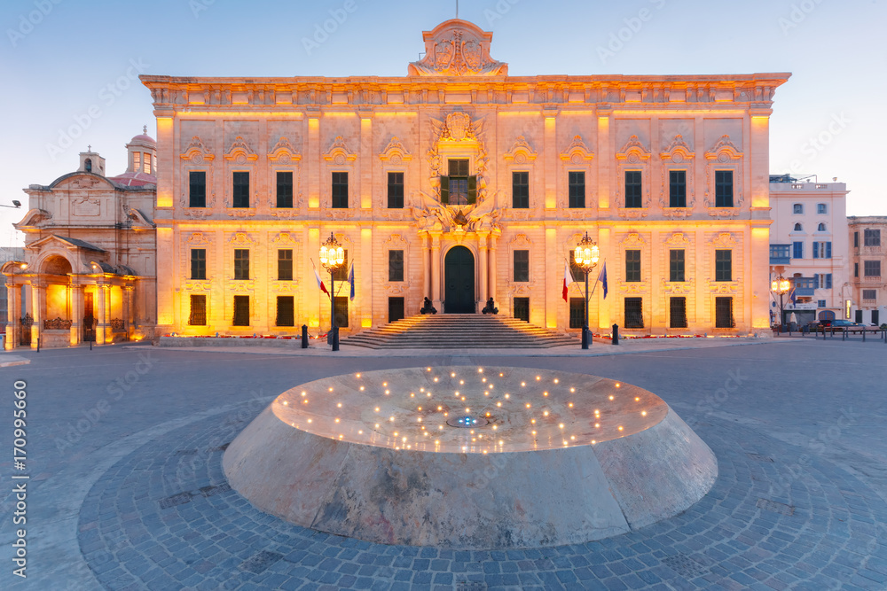 Fototapeta premium Auberge de Castille in the Baroque style, probably the finest building in Malta, during morning blue hour, Valletta, Malta