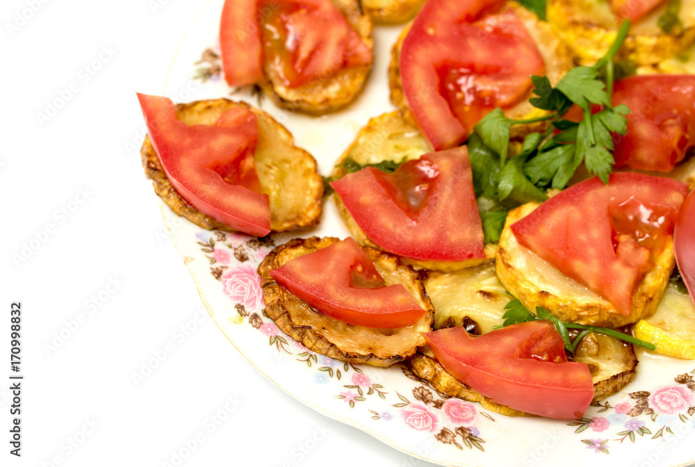 Fried zucchini and tomato food salad
