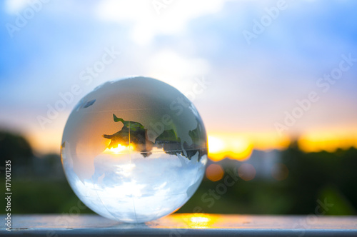Fototapeta Naklejka Na Ścianę i Meble -  Transparent globe with sunset background