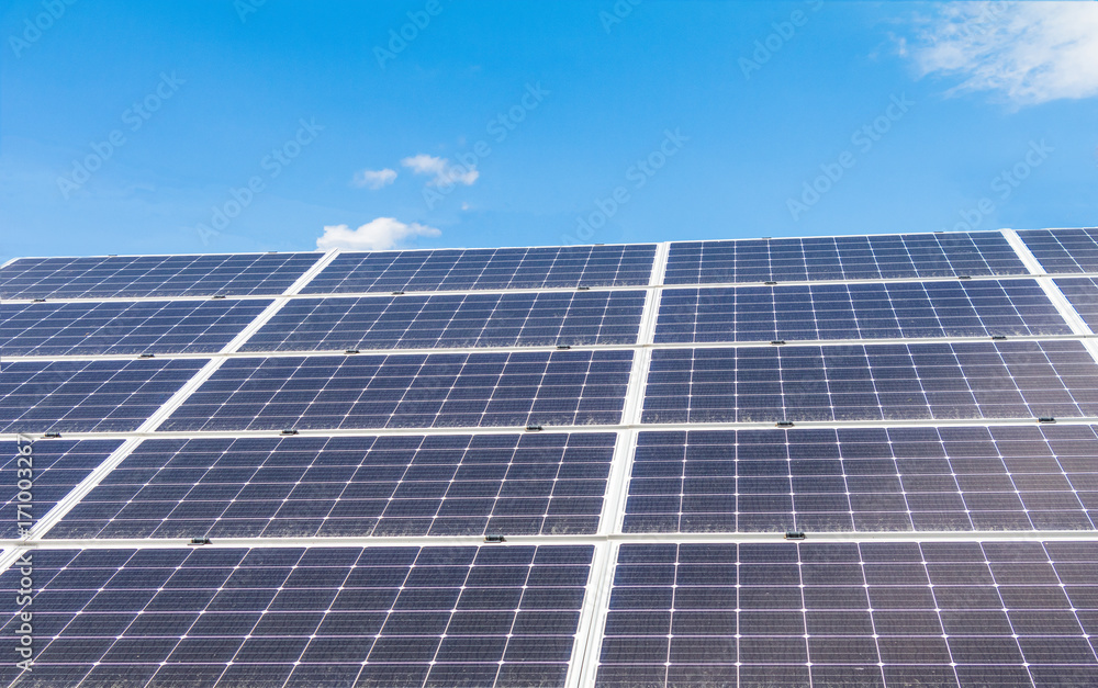 Solar power panels for innovation green energy for life with mountains and blue sky background. Solar power panels for innovation green energy for life with mountains and blue sky background.