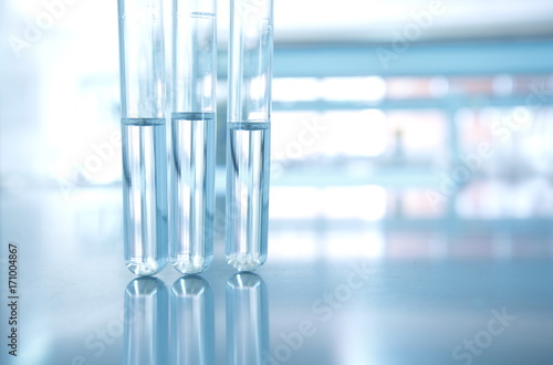 three glass test tube with water in research science chemical laboratory background