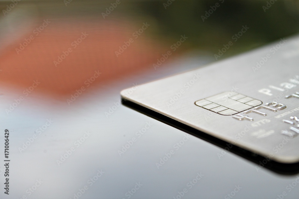 Business, finance, credit card, shopping, saving money, banking, loan, investment, taxes or accounting concept : Credit card on office desk table Business, finance, credit card, shopping, saving money, banking, loan, investment, taxes or accounting concept : Credit card on office desk table