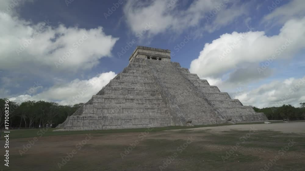 CHICHEN ITZA, MEXICO - MAY 25, 2017: Movement along Maya pyramid temple of Kukulkan in Mexico on the background at cloudy blue sky CHICHEN ITZA, MEXICO - MAY 25, 2017: Movement along Maya pyramid temple of Kukulkan in Mexico on the background at cloudy blue sky