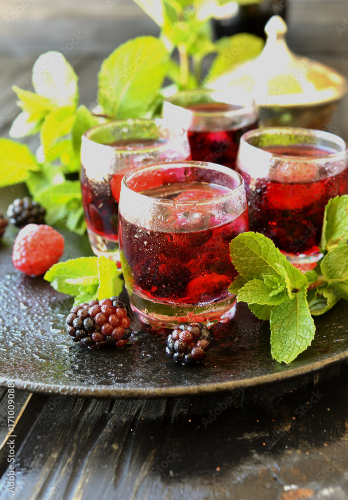 berry juice in a glass with berries, selective focus berry juice in a glass with berries, selective focus
