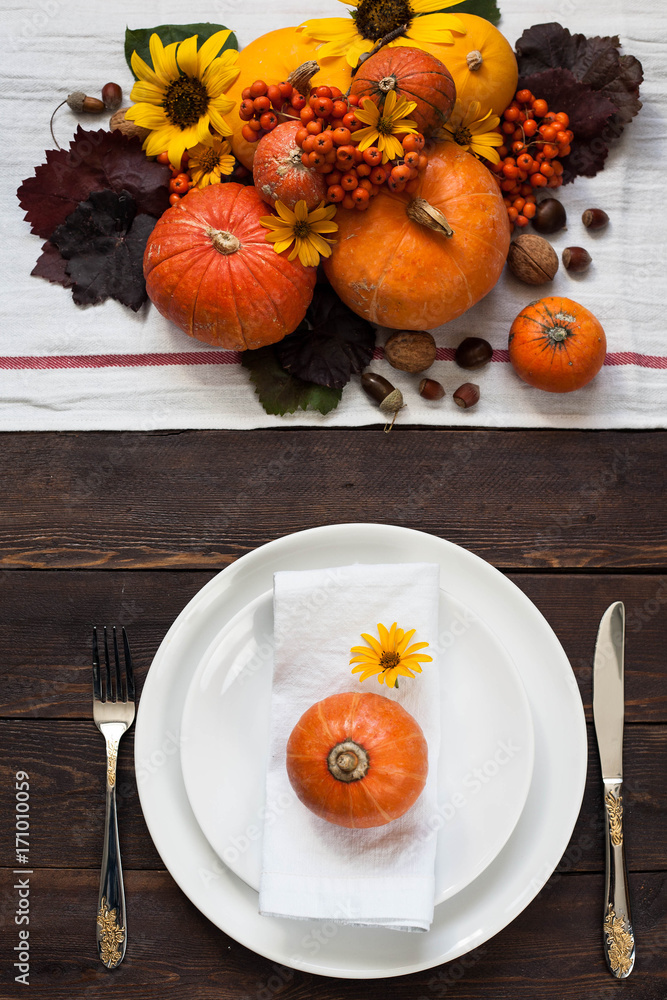 Table setting with autumn colors of pumpkin Table setting with autumn colors of pumpkin