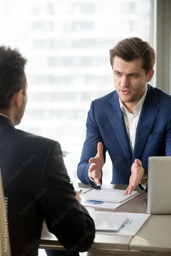 Fotografie Serious successful businessman discussing company results with financial directo