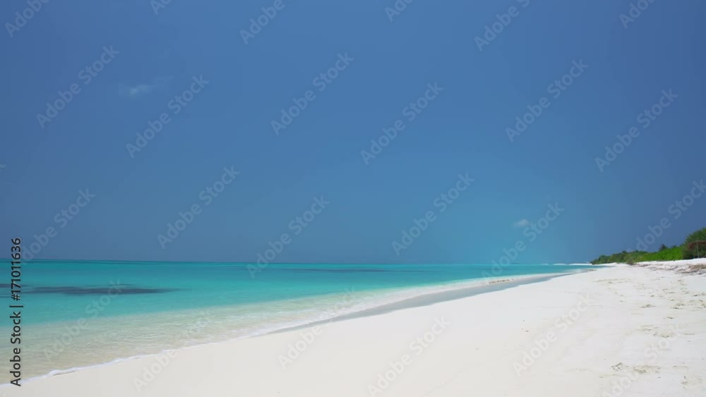 Tropical sandy beach with calm waves. Maldivian destination with nobody Tropical sandy beach with calm waves. Maldivian destination with nobody