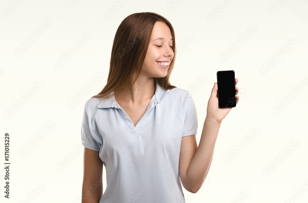 Young attractive woman with phone. Casual girl. Smiling portrait. Beautiful woman. Studio shot. Young attractive woman with phone. Casual girl. Smiling portrait. Beautiful woman. Studio shot.
