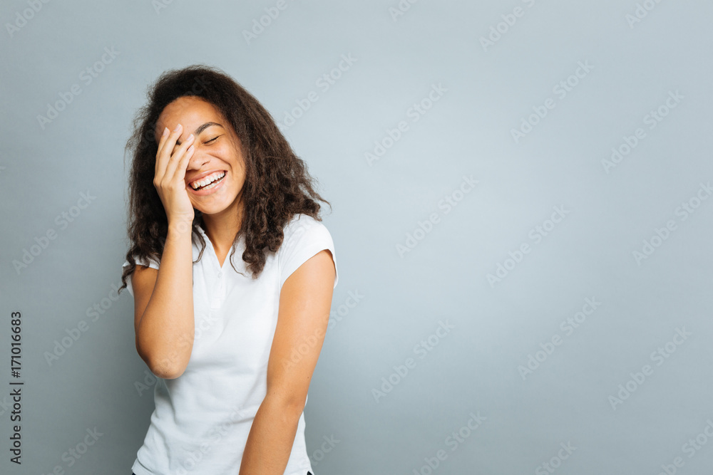 Happy female putting hand on her face Happy female putting hand on her face