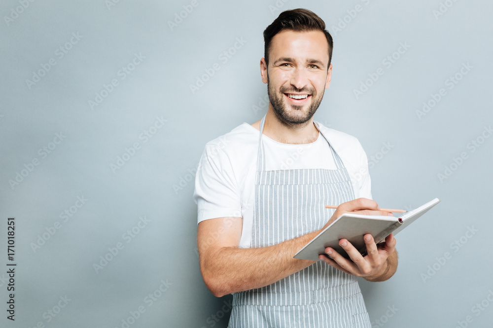Attractive male making some notes Attractive male making some notes