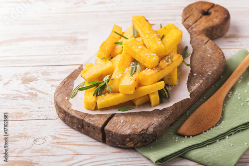 Polenta fries with rosemary. Italian appetizers. Horizontal view.