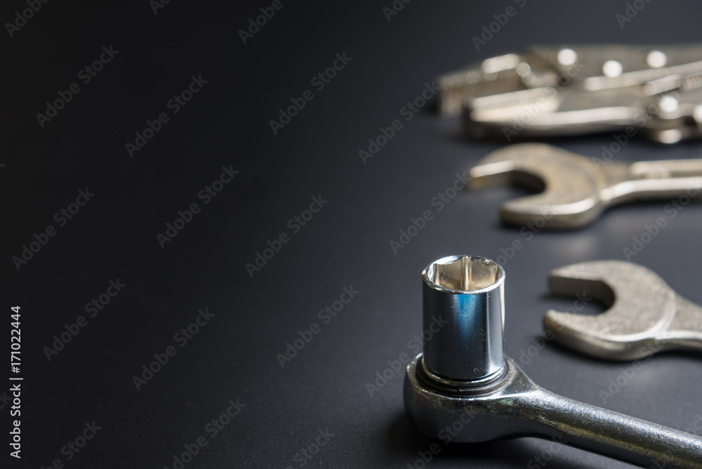 Car repair tools on the black background.selective focus. Car repair tools on the black background.selective focus.