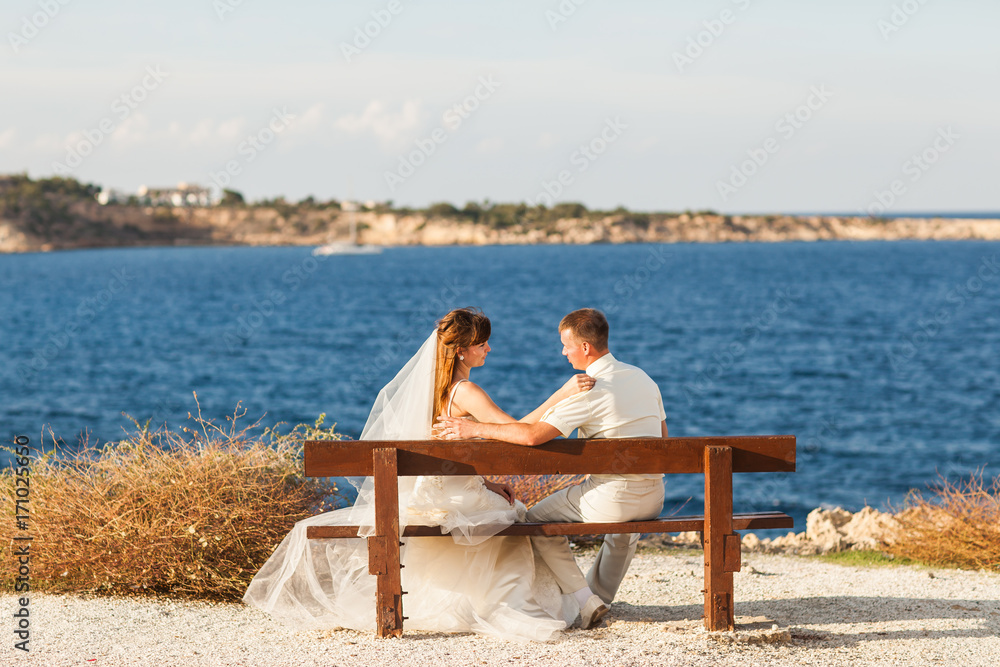 Bride and groom on a romantic moment on nature. Stylish wedding couple outdoors Bride and groom on a romantic moment on nature. Stylish wedding couple outdoors