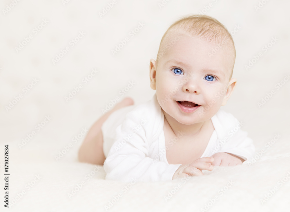 Baby Boy in White, Happy Newborn Infant Kid Portrait, Cute Child Lying on front