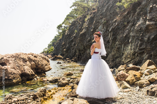 Beautiful young bride on nature