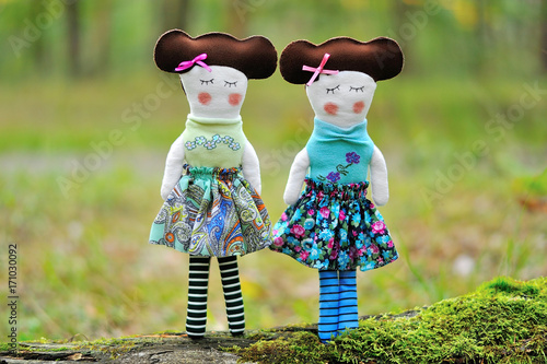 Two bright stylish dolls handmade in nature photo