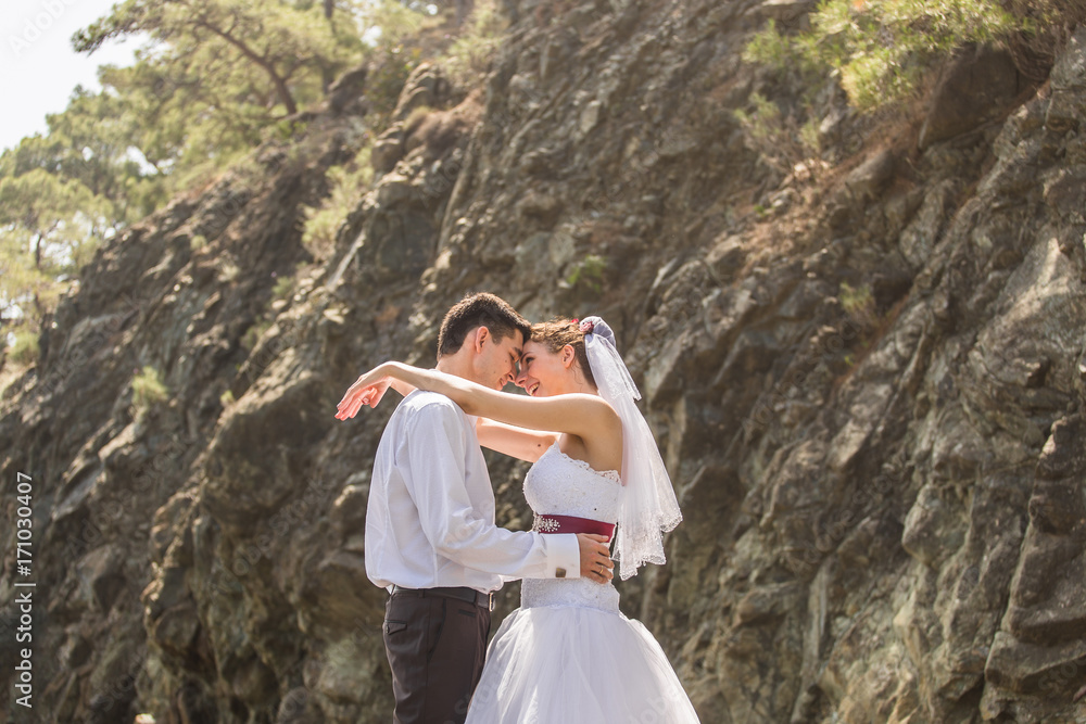 Naklejka premium Just married couple embraced