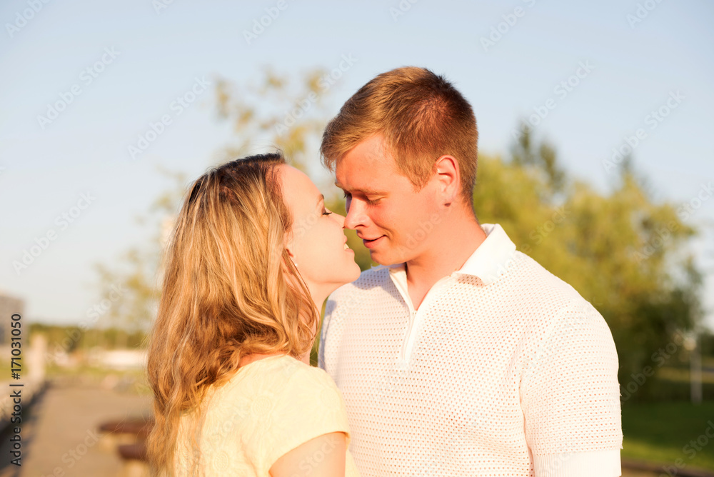 portrait of a young family couple kissing